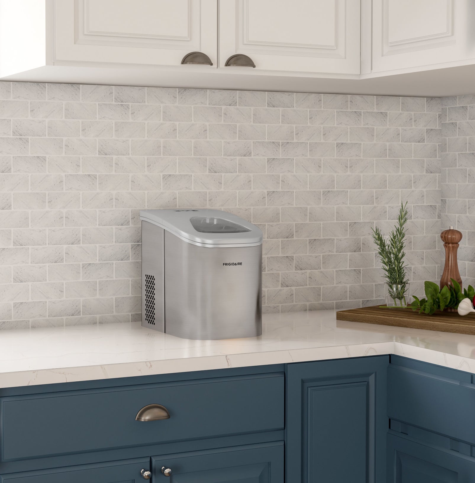 silver ice maker on a counter