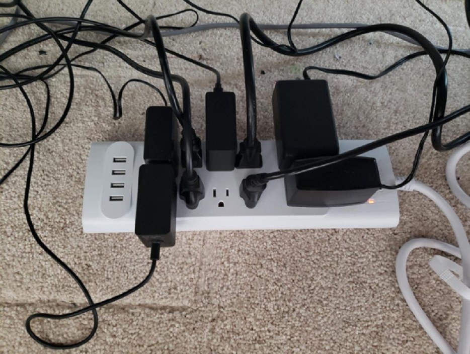 A powerstrip with ten outlets and four USB ports