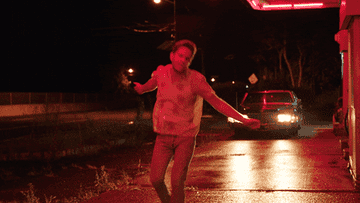 Ben Platt dances on the street, twirling around
