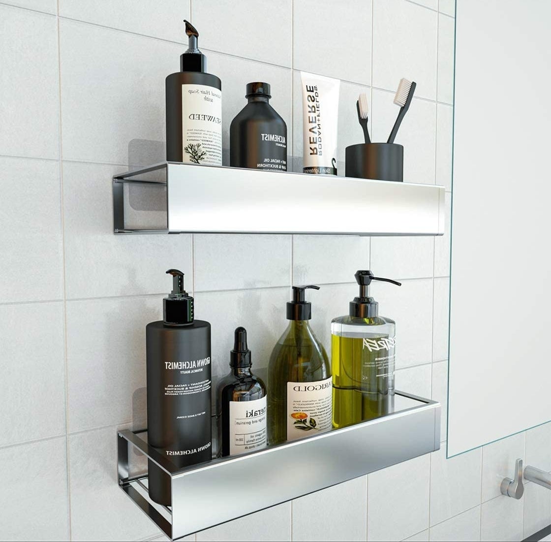 A pair of wall-mounted stainless steel shelves containing personal care products