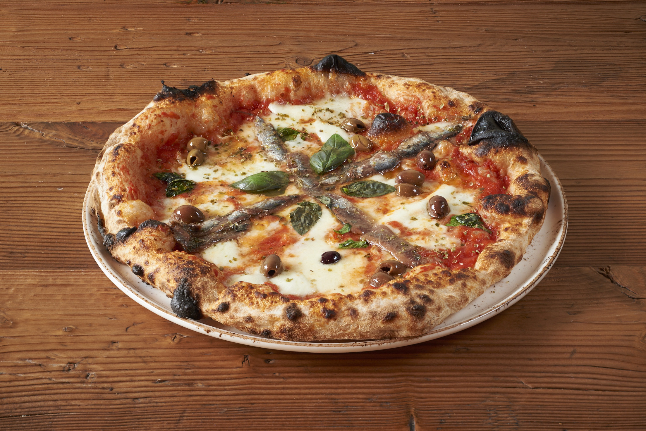 A Neopolitan pizza with anchovies