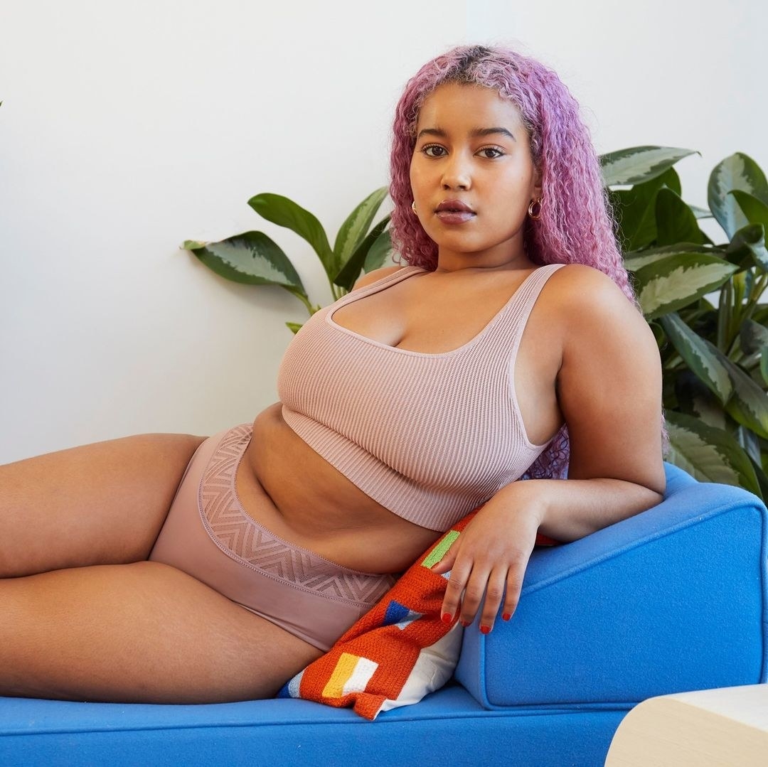 model wearing blush-colored briefs with a geometric-patterned waist band