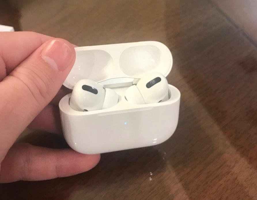 the AirPods Pros in a white case