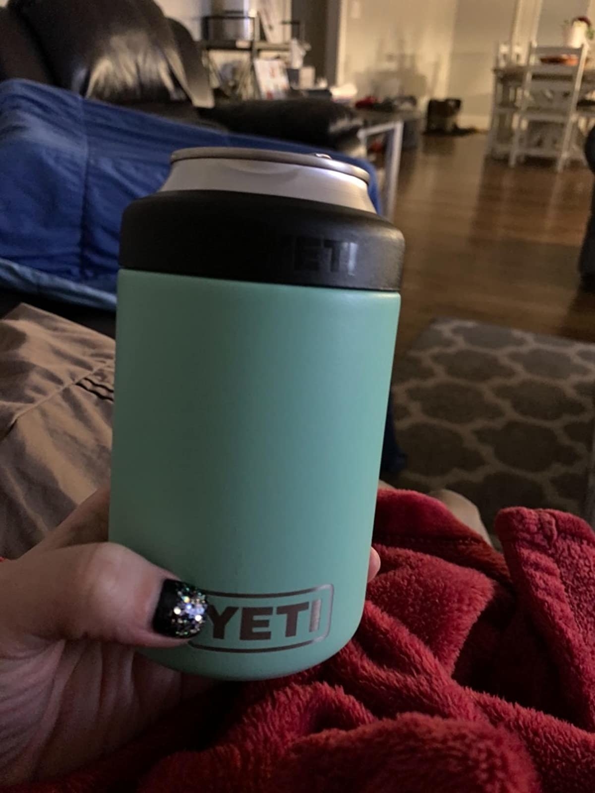 reviewer photo of holding a beer can in the koozie