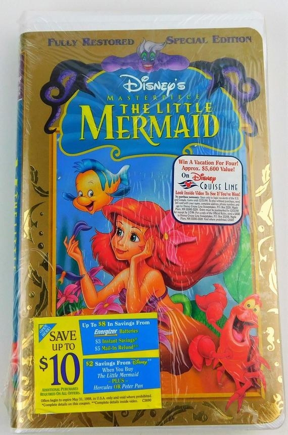 A Little Mermaid VHS tape still in its packaging with a coupon sticker on the cover 