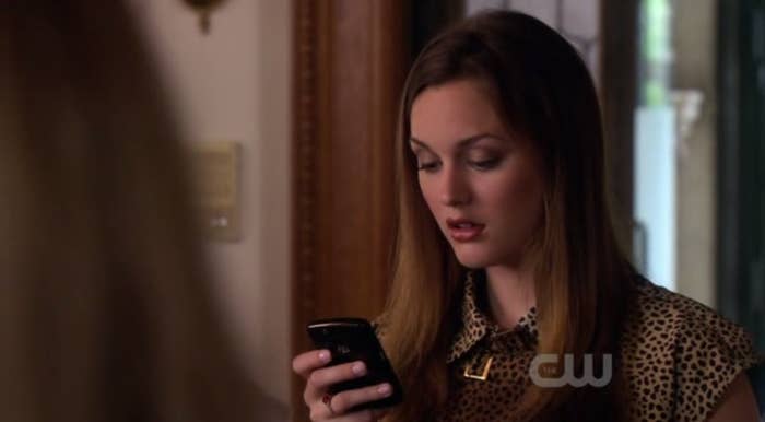 Blair Waldorf looking down at her phone 