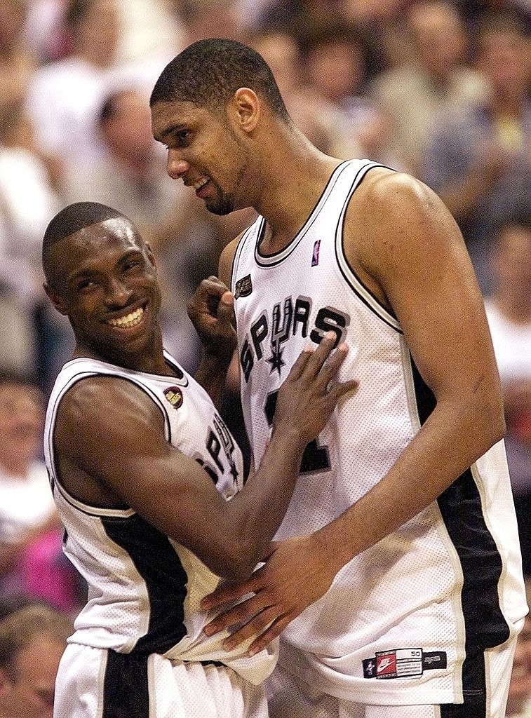 Two basketball players hugging