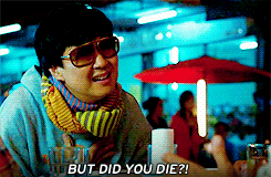 A man in a colorful outfit and large sunglasses saying, &quot;But did you die?&quot;