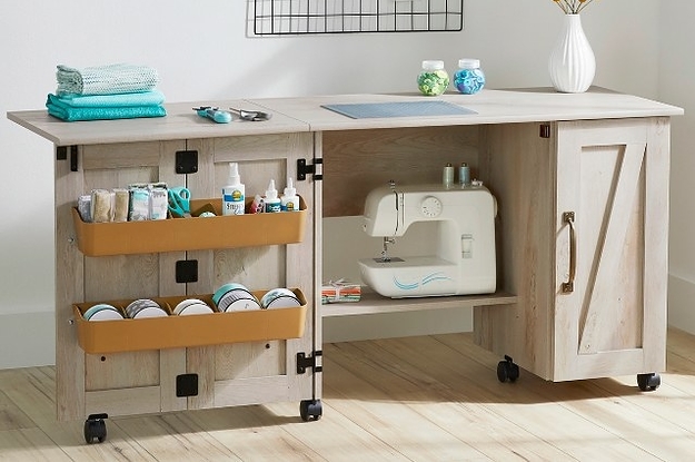 an open sewing table in a craft room