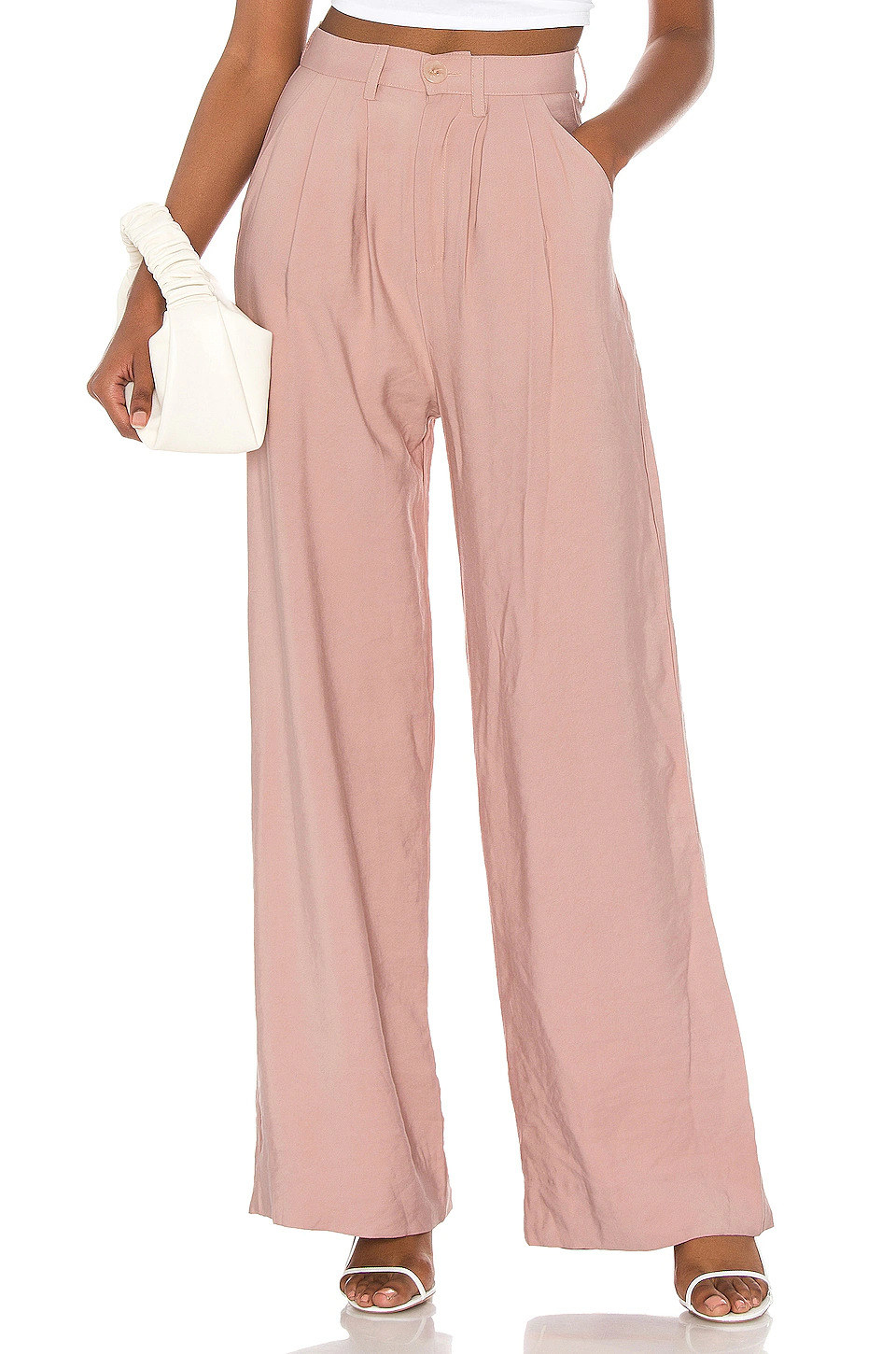 Model wearing light pink pants with pockets