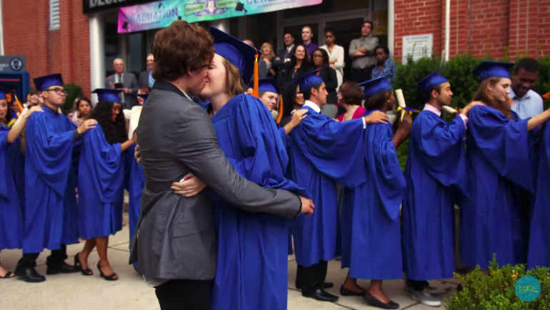 Eli and Clare kissing at her graduation