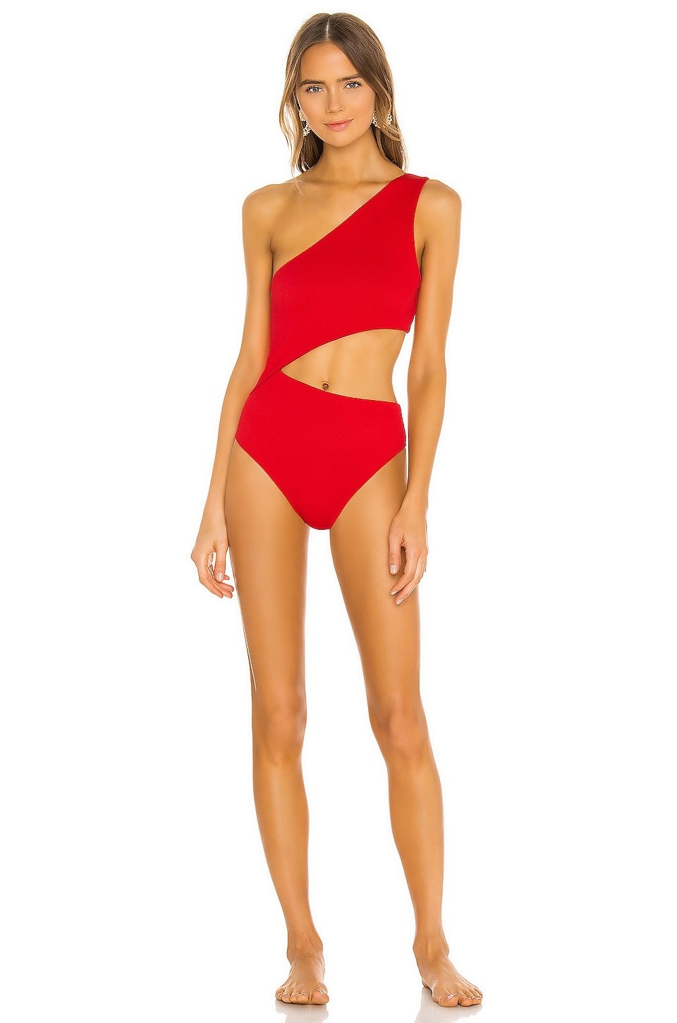 Model wearing red bodysuit with cut-out in the middle