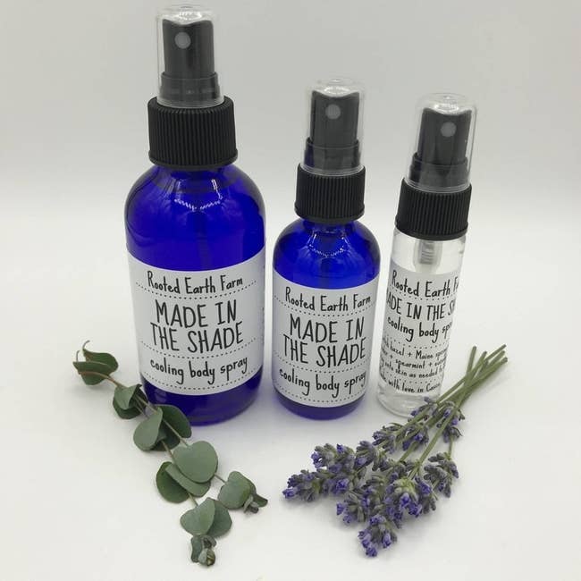 Three sizes of Rooted Earth Made In The Shade Cooling Body Spray in various sizes