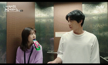 seehee and jiho in a comically dramatic awkward standoff in the elevator 