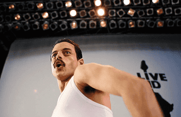 Rami as Freddie singing