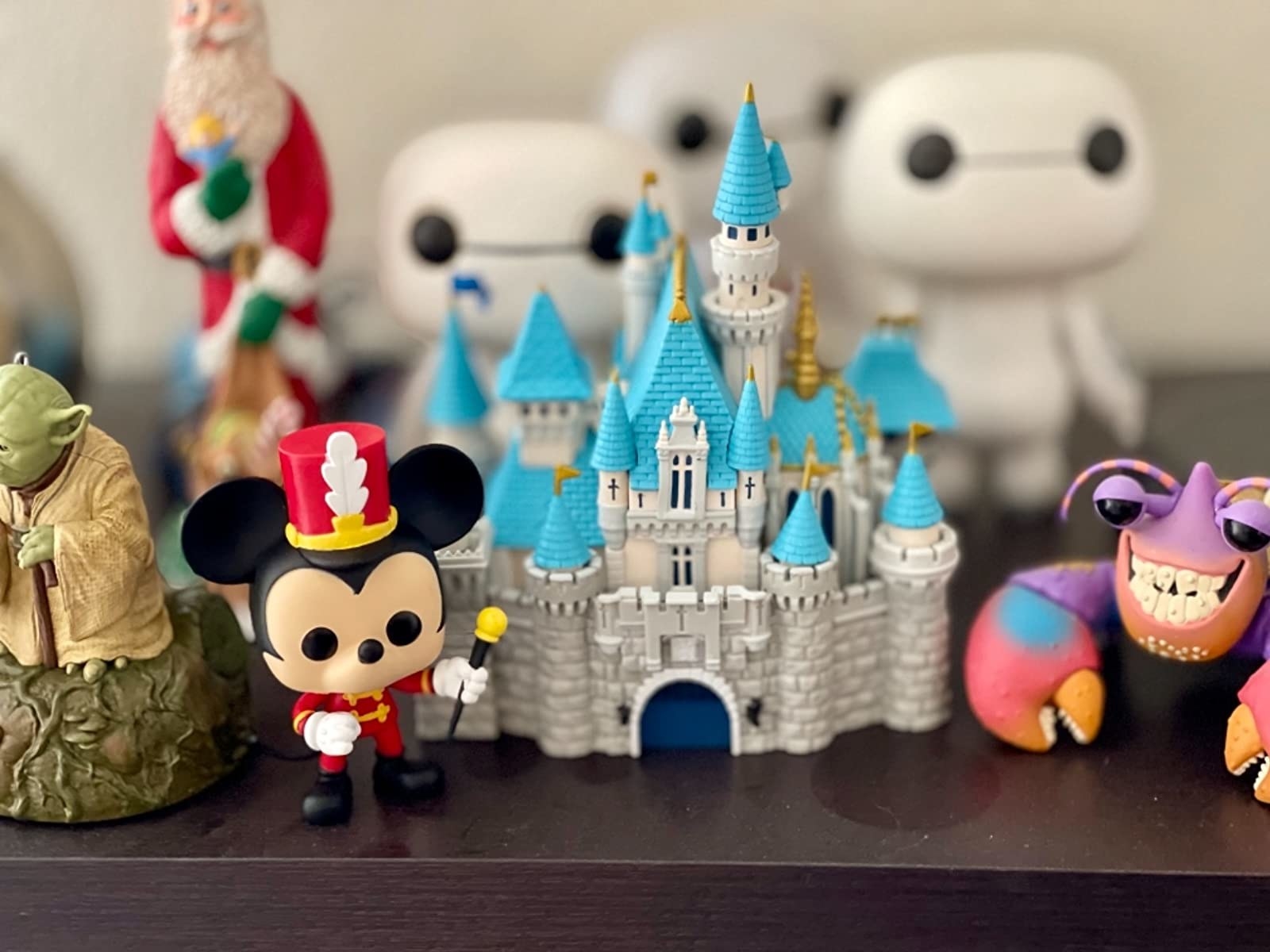 castle and mickey mouse figures 
