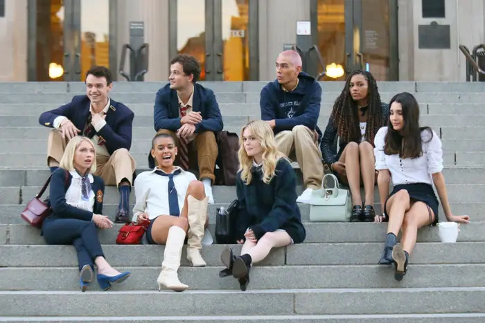 The cast of the Gossip Girl reboot sits on the Met steps