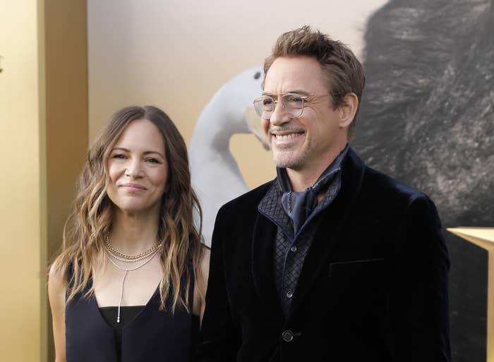 Susan Downey stands next to Robert Downey Jr; they're both smiling