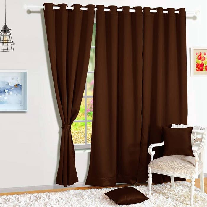 A pair of brown light-blocking curtains.