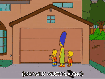 Bart, Marge, and Lisa Simpson standing in front of a garage
