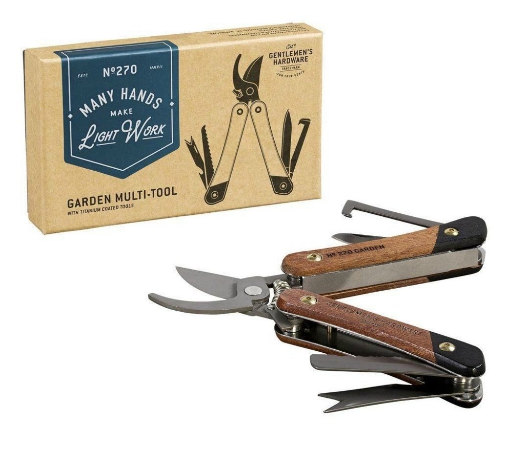 garden multi-tool with different tools popped out with the package in the background