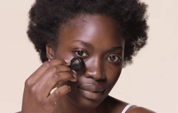 gif of a model rolling the revlon face roller across their cheeks