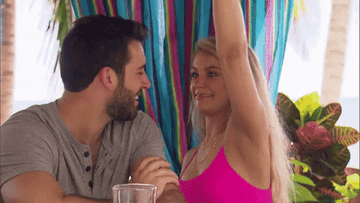 Gif of contestant from &quot;Bachelor In Paradise&quot; sniffing another contestant&#x27;s armpit
