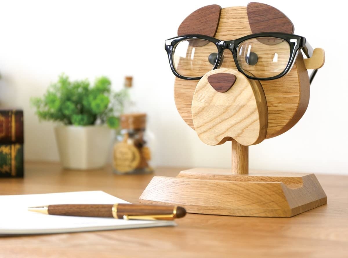product image of the glasses holder with a pen and notepad