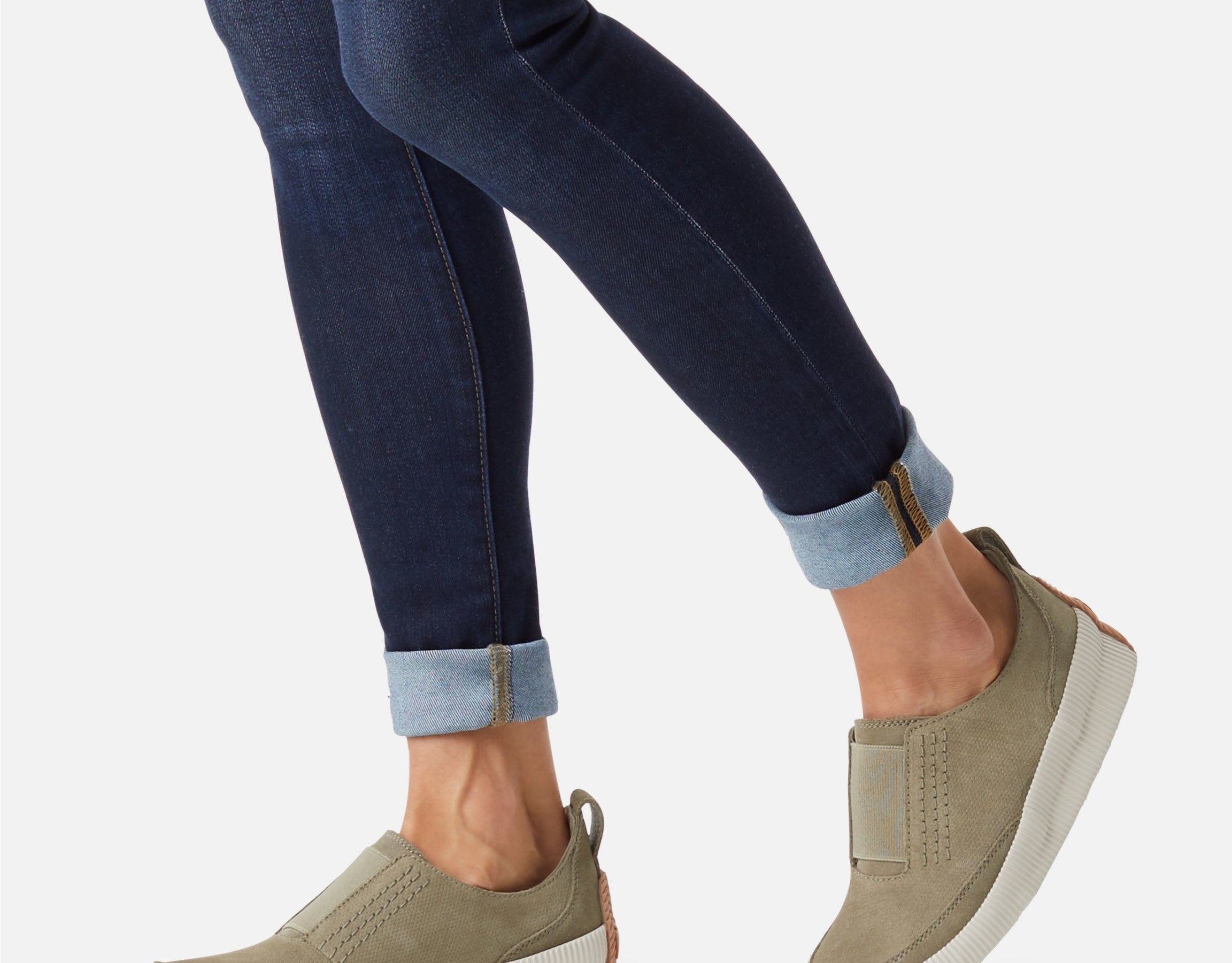 model wearing the slip-on shoes in the color sage