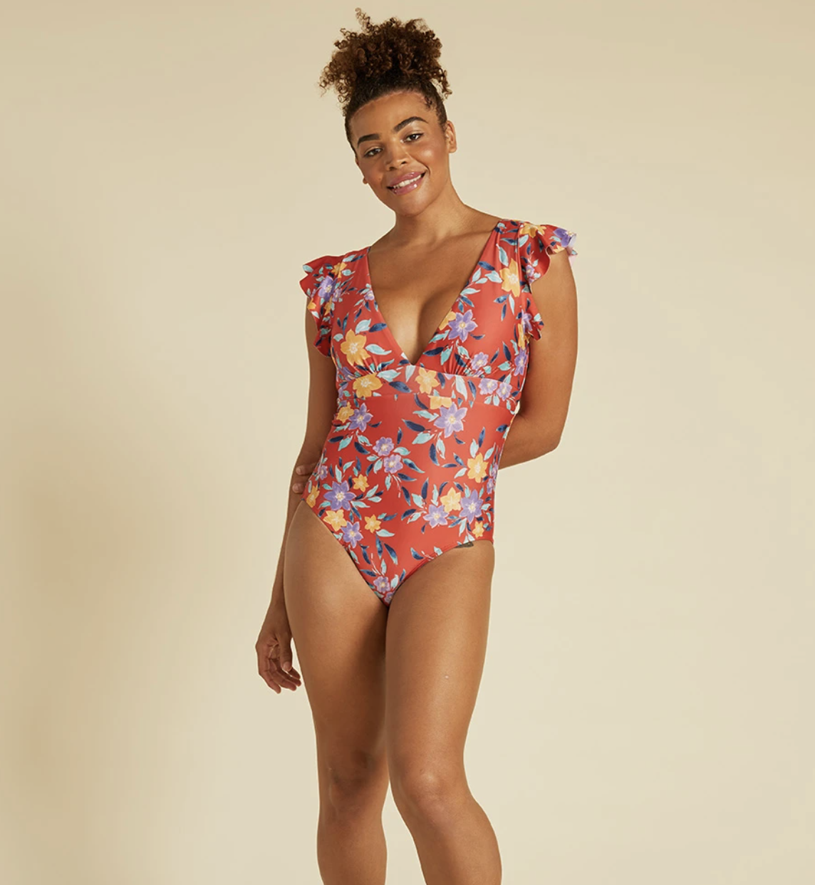 model wearing floral one-piece bathing suit