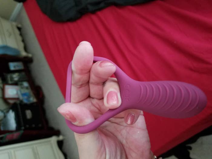 Model stretching ring of pink silicone cock ring