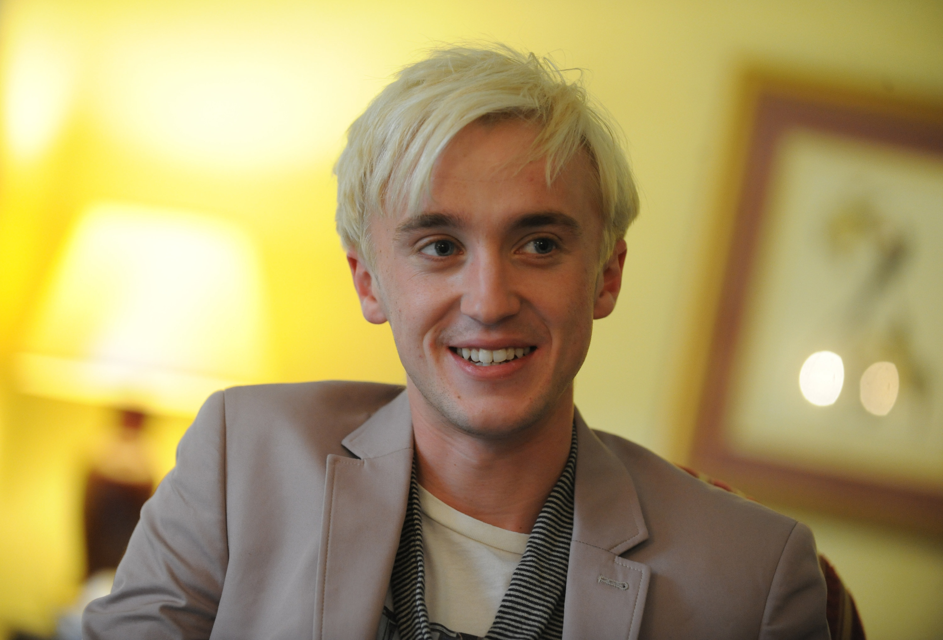 Tom Felton, who plays evil Draco Malfoy in the &quot;Harry Potter&quot; movies, smiles while being interviewed at the Royal York Hotel in London, 2009