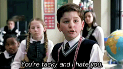 boy in a classroom saying, &quot;You&#x27;re tacky and I hate you.&quot;
