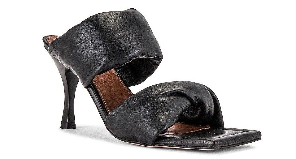Black shoes with puffy straps and brown sole 