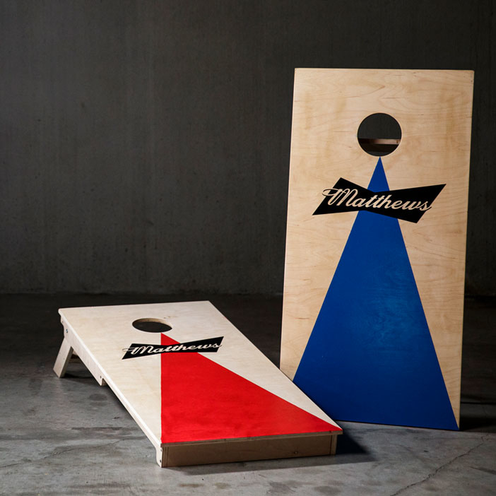 The personalized corn hole boards on display in red and blue