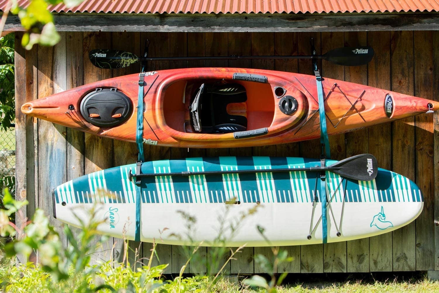 A canoe and a paddle board in the straps