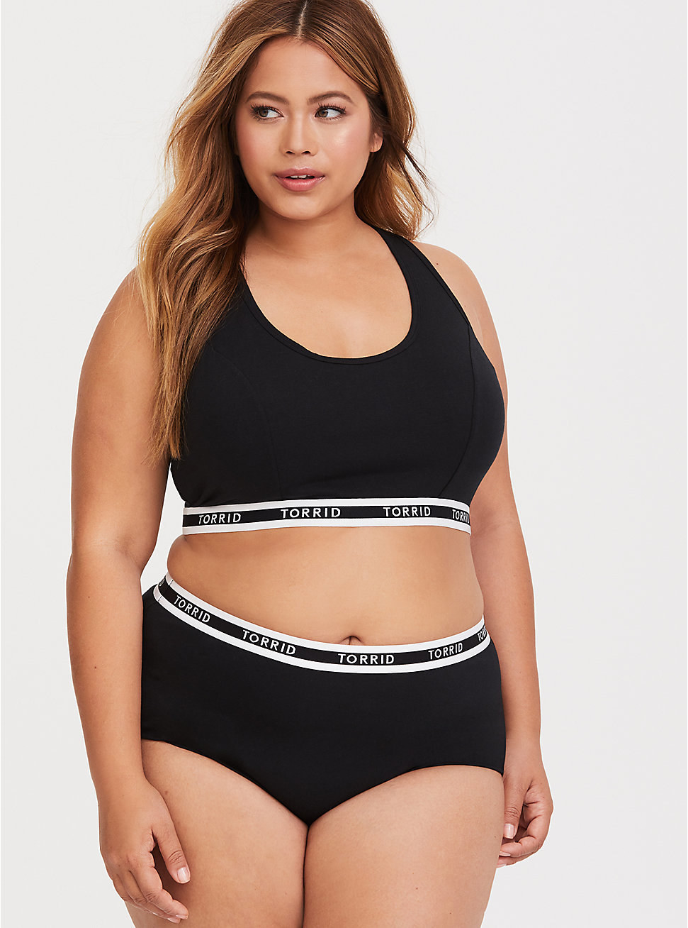 model wearing the black cotton briefs with Torrid logo waistband
