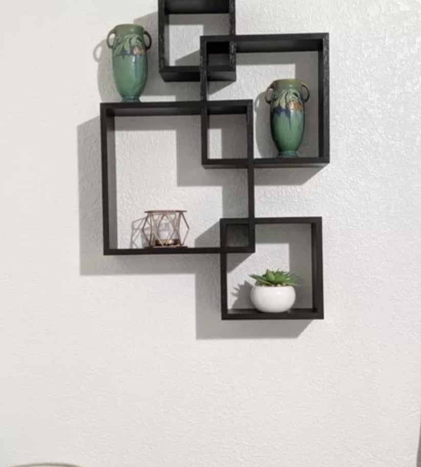 A reviewer&#x27;s set of black square floating shelves