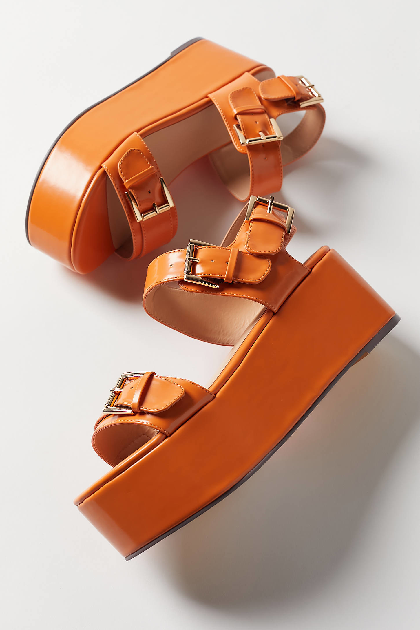 The sandals in orange 