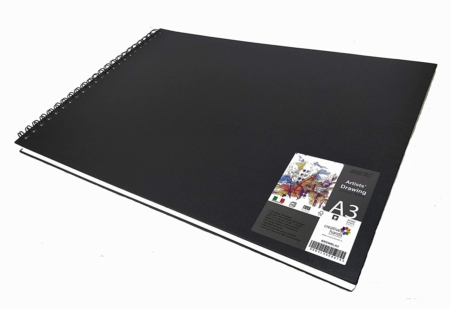 A closed sketch book with a black cover.