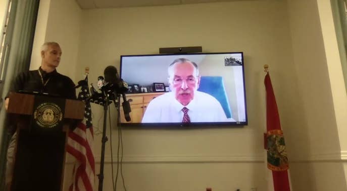 Sheriff Ric Bradshaw is shown speaking on a TV screen