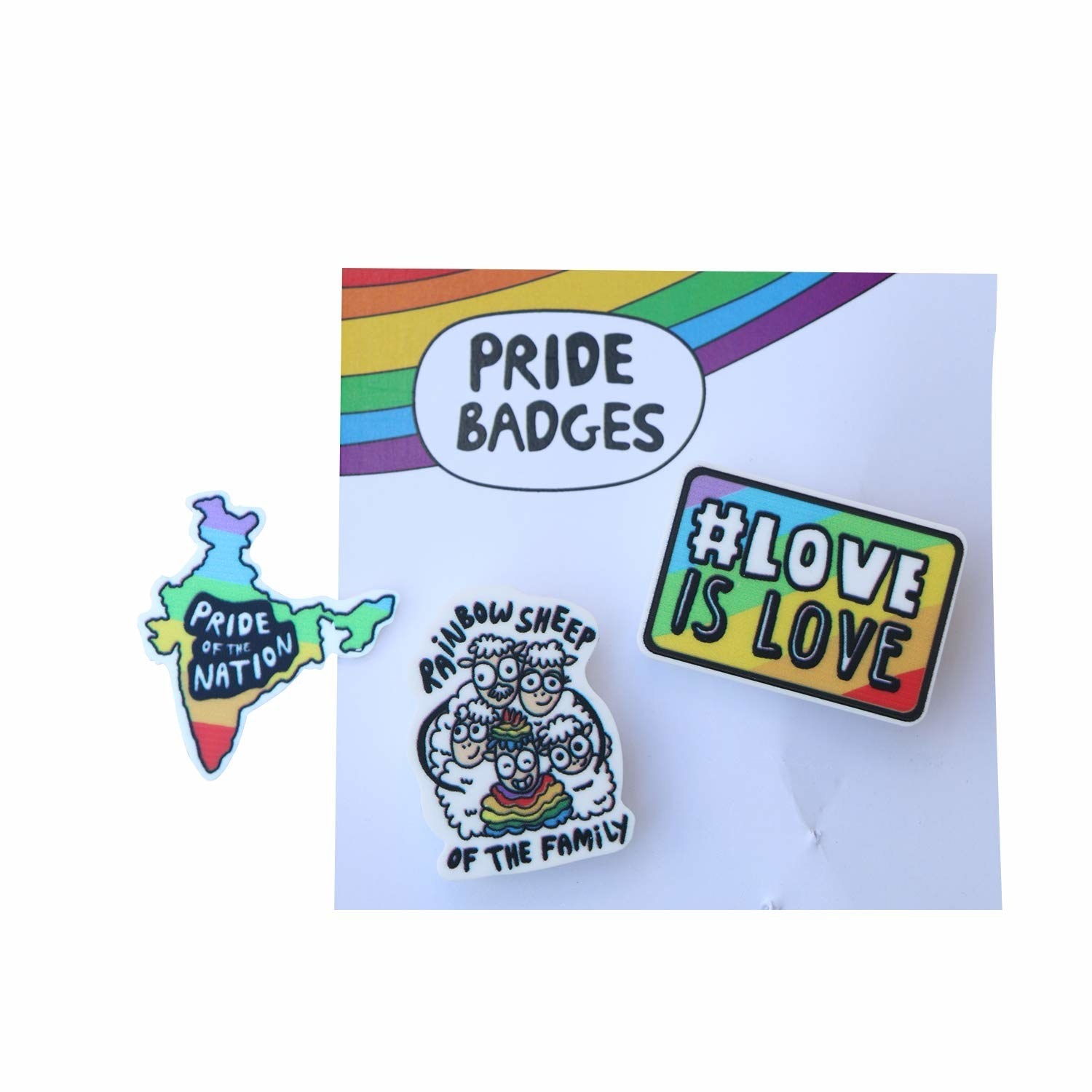 Rainbow coloured pins that say &#x27;Love is love&#x27;, &#x27;Pride of the nation&#x27; and &#x27;Rainbow sheep of the family&#x27;