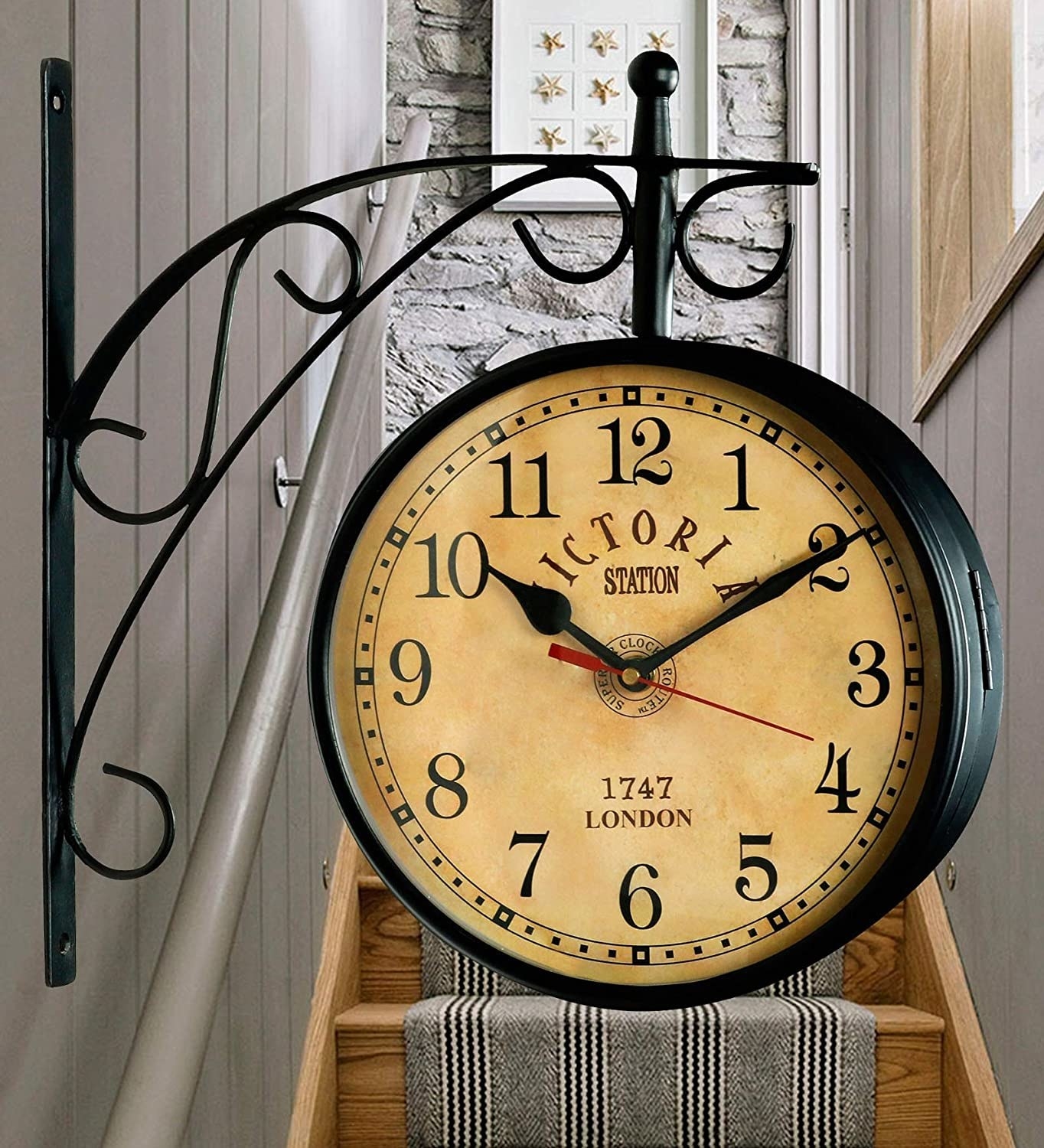 A vintage station clock hanging on a wall. 