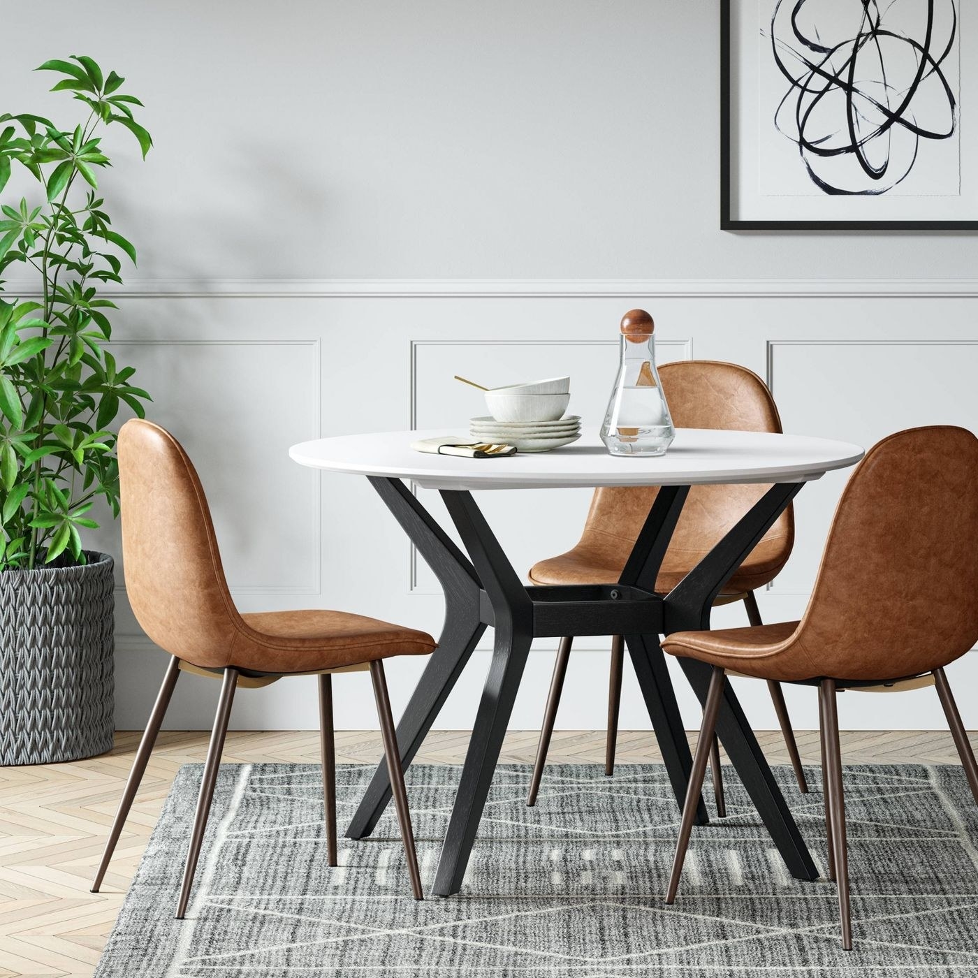 The white table with black legs in a dining area