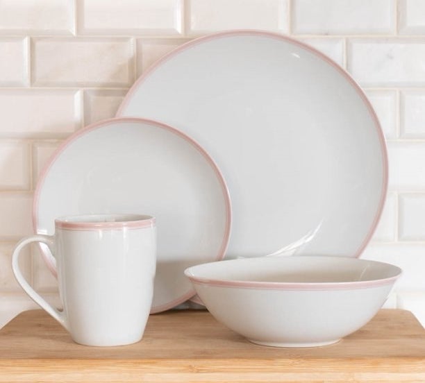 pink and white dinnerware set on kitchen counter