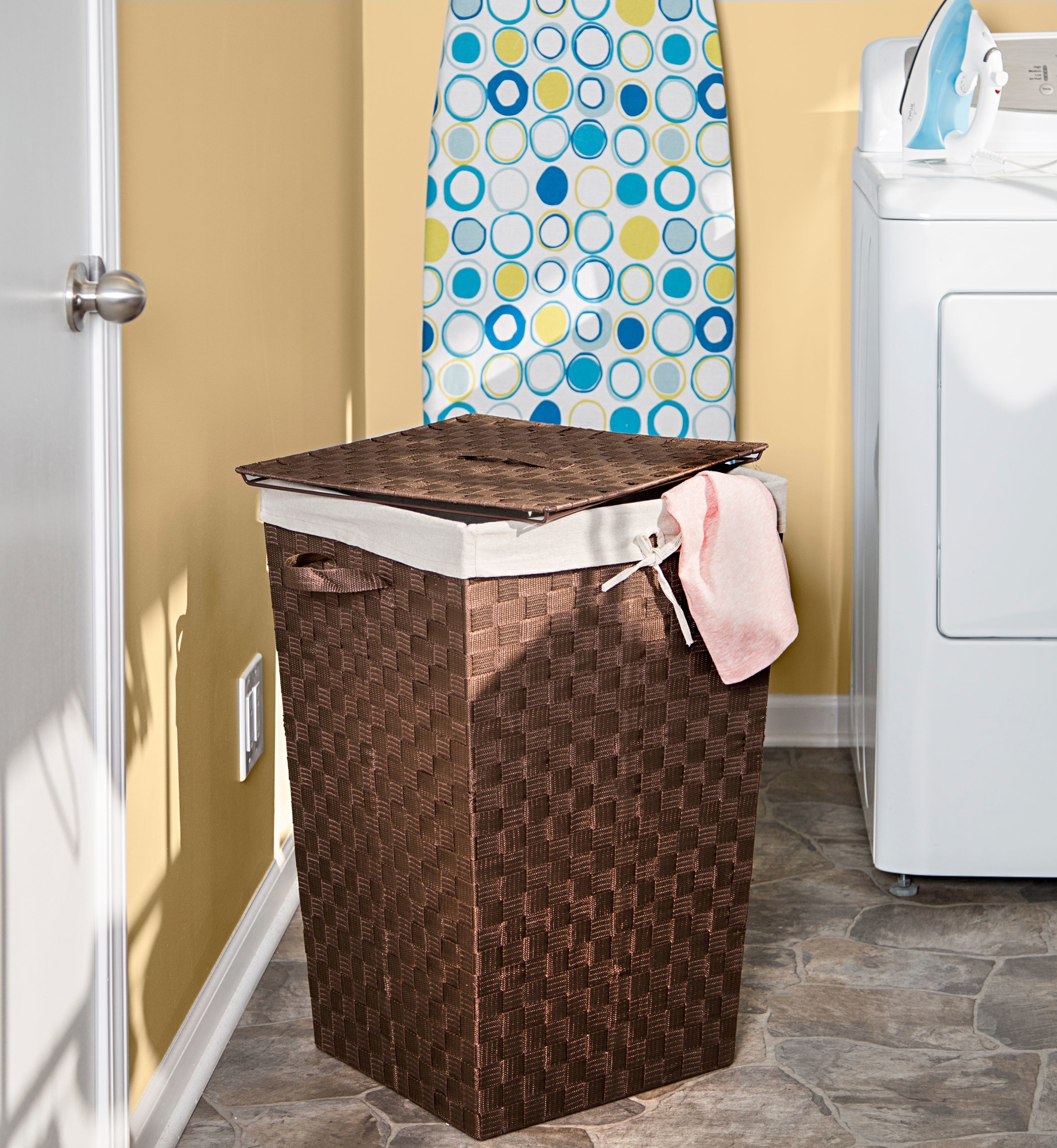 brown woven laundry hamper in laundry room