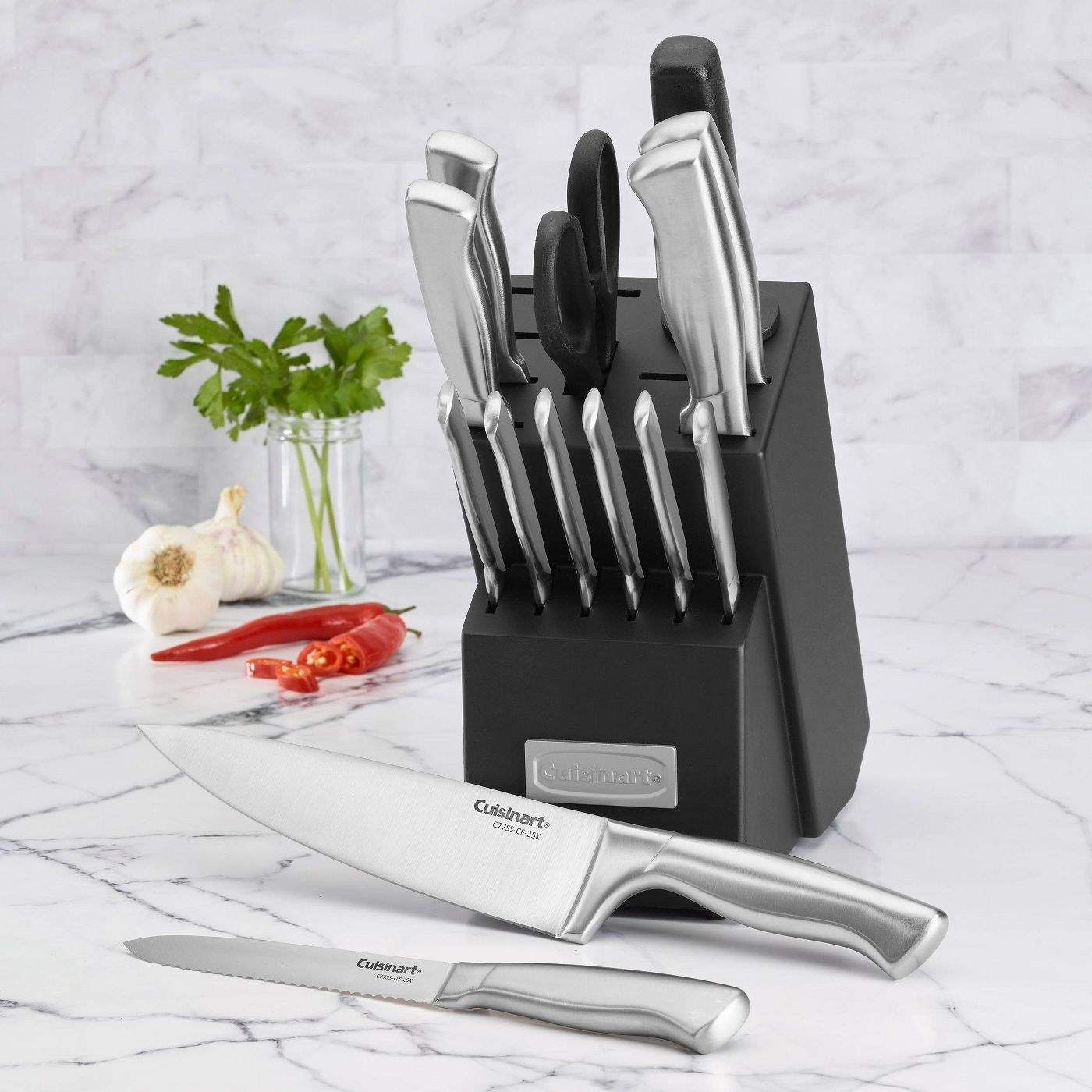 stainless steel knife set with a black knife block 