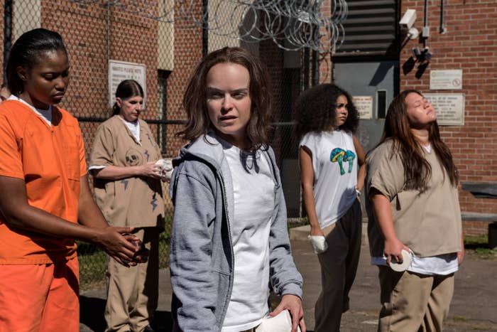Taryn Manning stands in a prison courtyard on set of &quot;Orange Is The New Black,&quot; Season 5
