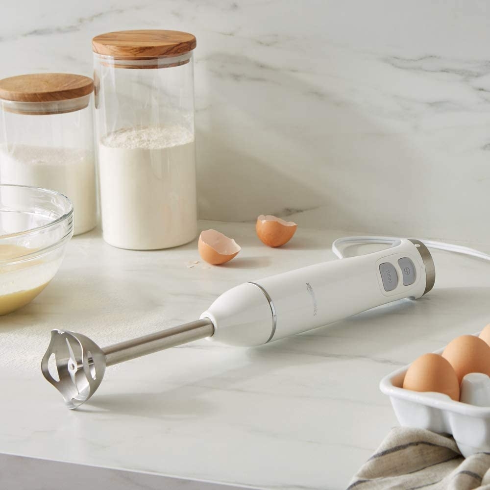the blender on a counter with baking ingredients