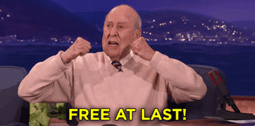 A gif of Carl Reiner throwing his hands in the air and proclaiming, free at last!